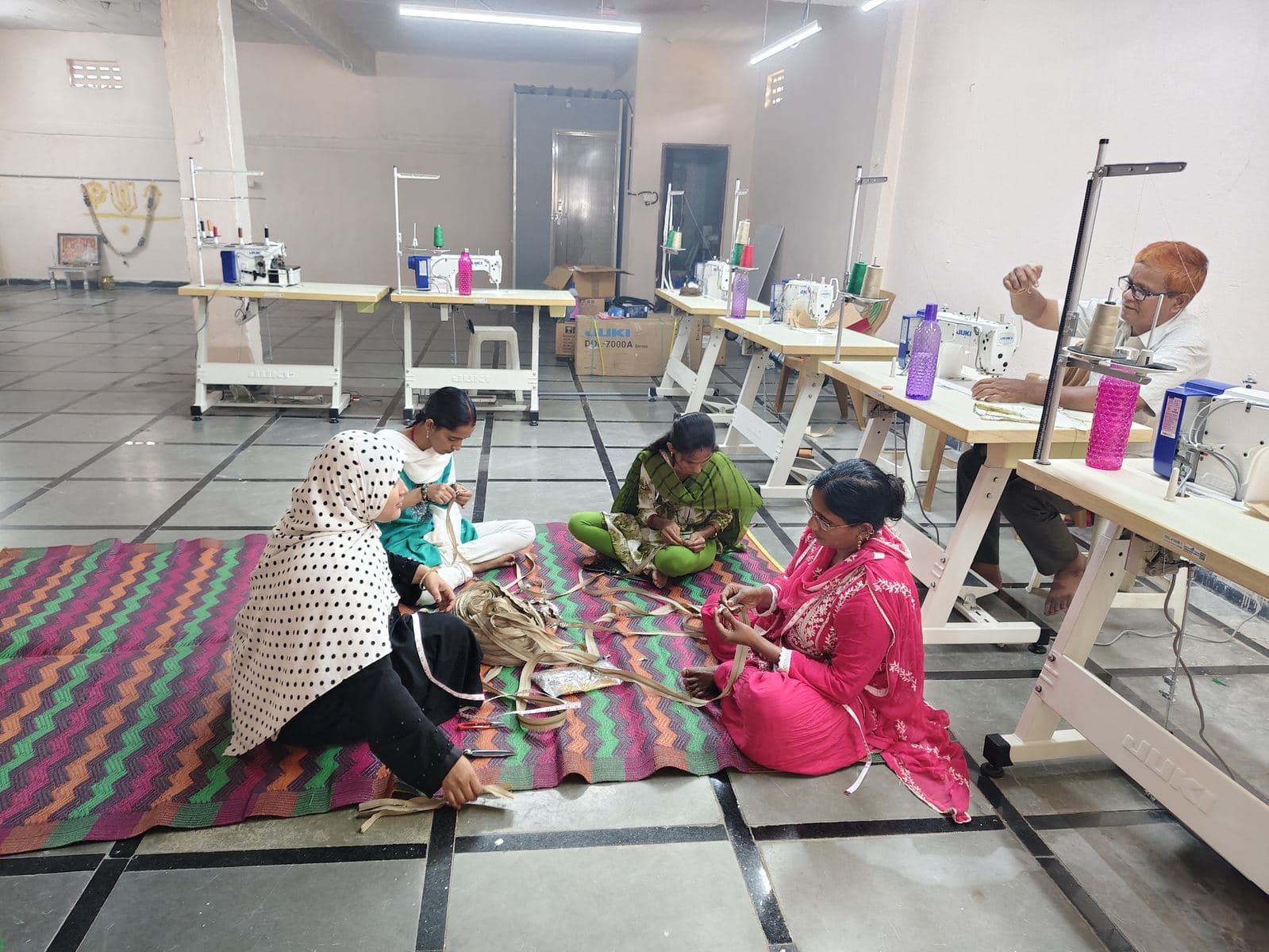 HuskWorks team hand-stitching jute bags at the Hyderabad workshop